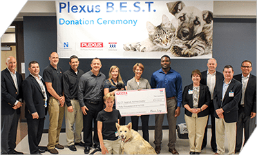 Winning team members of a Plexus continuous improvement competition selected a local animal shelter to receive a monetary contribution